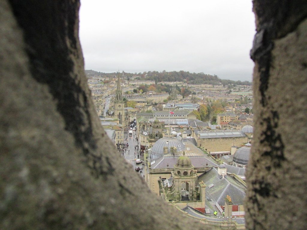 View of Bath through the stones of Bath Abbey Tower