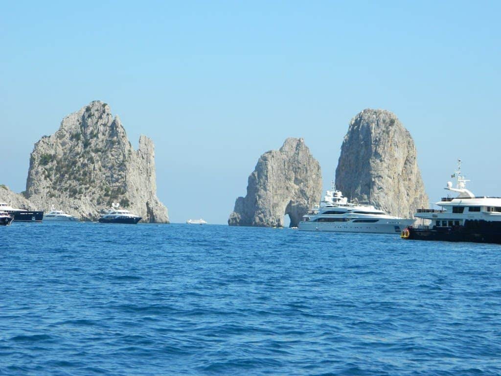 Yachts crowding the sea stacks